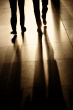 ist1_10040475-silhouettes-and-shadows-of-two-businessman-walking-in-corridor